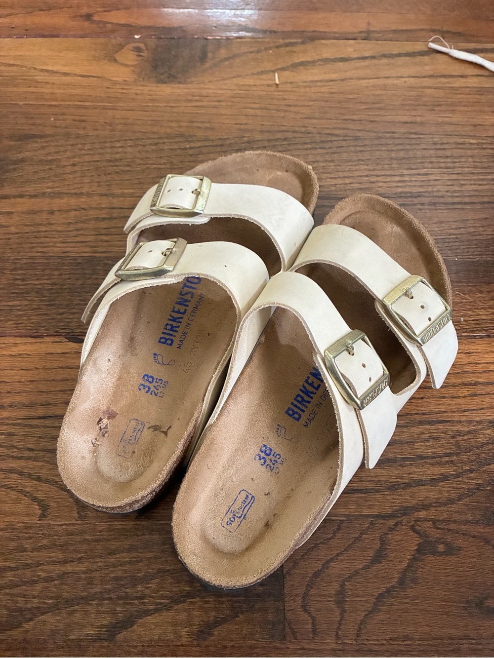 Birkenstock Two-Strap Sandals in Cream with Gold Buckles